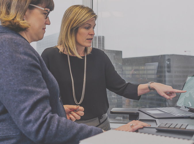 Meaden & Moore team members discussing audit & assurance accounting services
