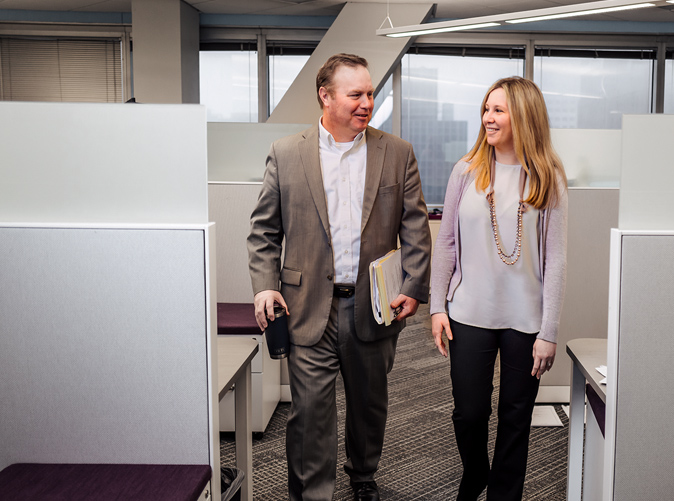 MEaden & Moore employees walking through office