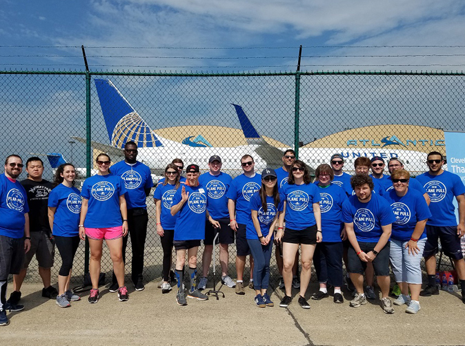 Group of Meaden and Moore employees at an airport