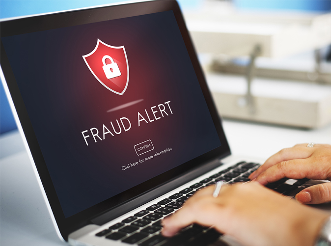 fraud alert on laptop screen