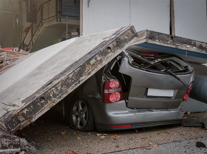 car crushed by concrete slab
