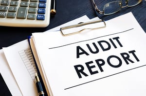 Audit Report With Business Documents in an Office
