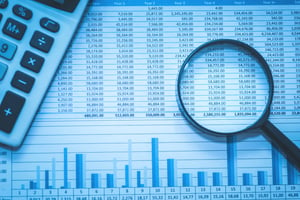 Spreadsheet Bank Accounts With Calculator and Magnifying Glass