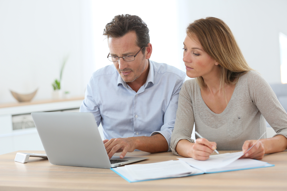 Couple at home working on laptop computer-2