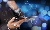 businessman hand showing blank flow chart on new modern computer as concept with bokeh exposure