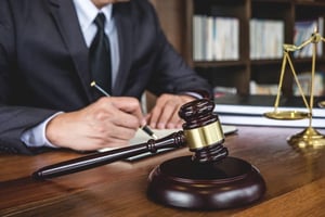 Lawyer Working on Documents in Courtroom