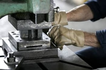 Manufacturing worker setting up a machine