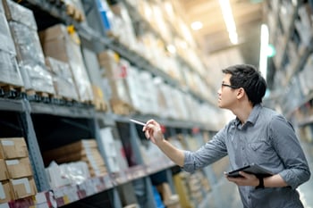 Young Man Stocktaking of Product