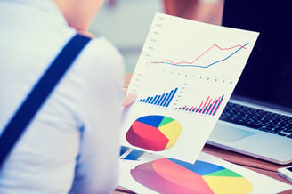 woman investment consultant analyzing company annual financial report balance sheet statement working with documents graphs. Stock market, office, tax, education concept. Hands with charts papers-Jan-27-2026-02-18-59-8965-PM