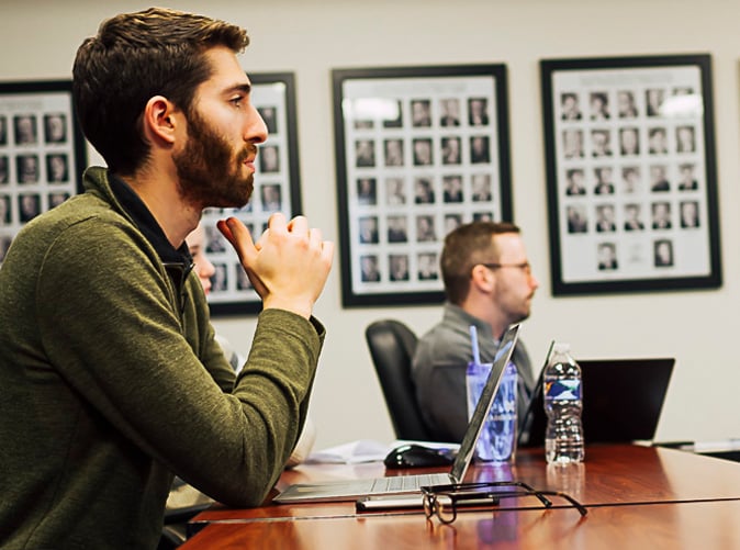 men sitting at conference table