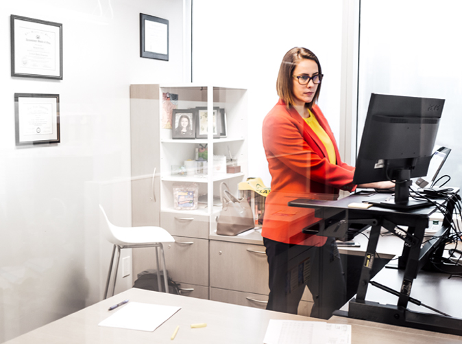 Meaden & Moore accounting professional using standing desk