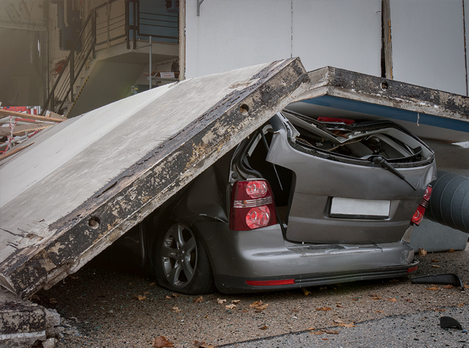 vehicle crushed by cement slab