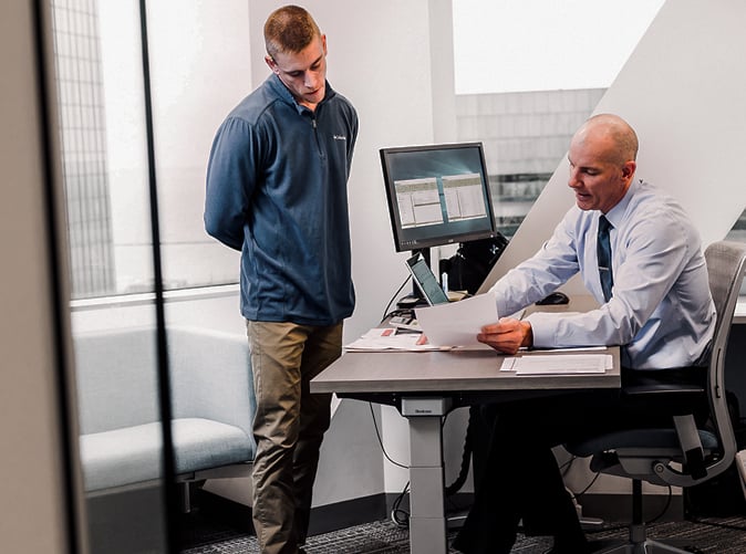 MEaden & Moore team members discussing fraud & forensic services