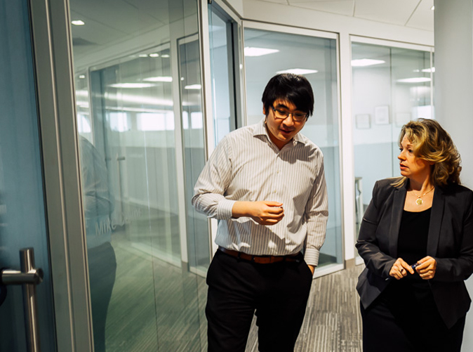 Meaden & Moore team members discussing tax strategies and walking through office