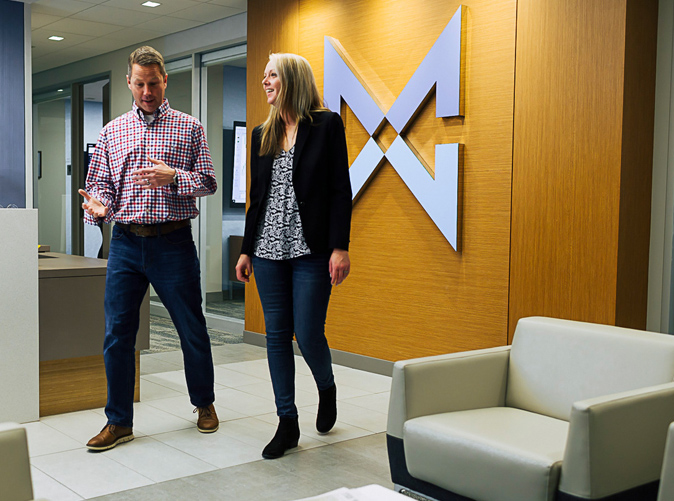 Meaden & Moore employees walking through common office area