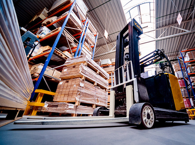 forklift moving materials in warehouse
