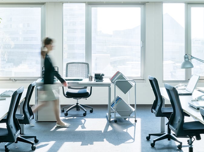 woman walking through office