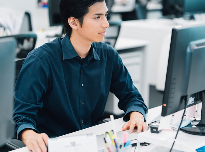 man working on computer in office