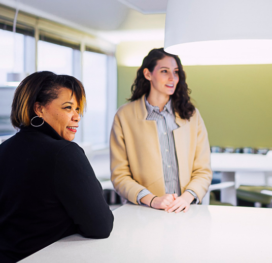 two professional women in an office